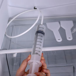 Refrigerator drain hole dredge
