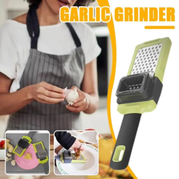 Manual garlic press and grinder